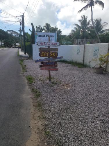 a street sign on the side of a road at Sunset View Self Catering in Anse Boileau