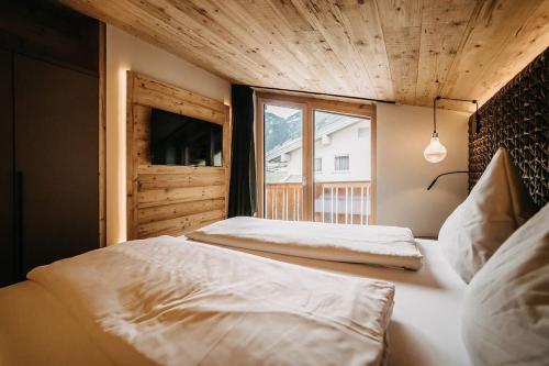 Posteľ alebo postele v izbe v ubytovaní Loft in the Alps Penthouse