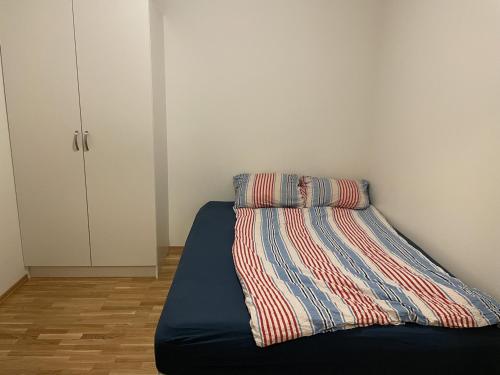a bed with two pillows on it in a room at privat room in penthouse Beautiful wiew in the heart of city center in Alta