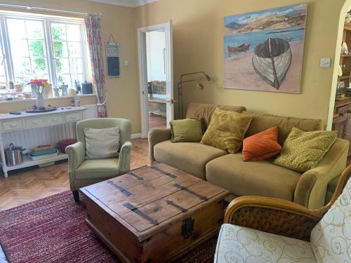 a living room with a couch and a coffee table at Inkerman in Lavant