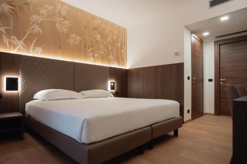 Posteľ alebo postele v izbe v ubytovaní Hotel Pineta