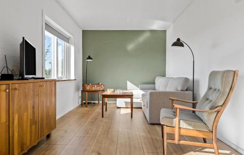 a living room with a couch and a table at Awesome Home In Tønder With Wifi in Tønder