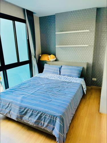 Ένα ή περισσότερα κρεβάτια σε δωμάτιο στο Minnie room Pattaya 3