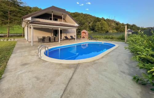 a swimming pool in front of a house at Lovely Home In Krapinske Toplice in Krapinske Toplice