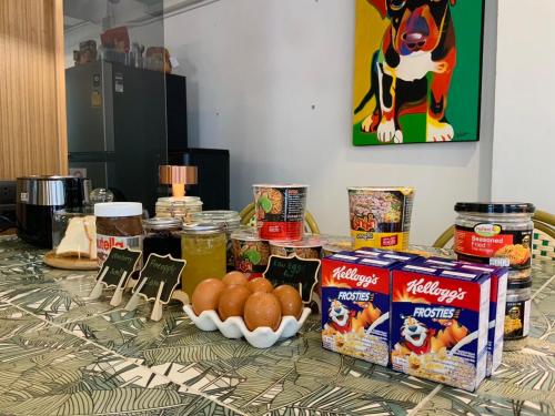 a table with some food on top of it at Unplugged at Bangrak Design Hostel in Bangkok