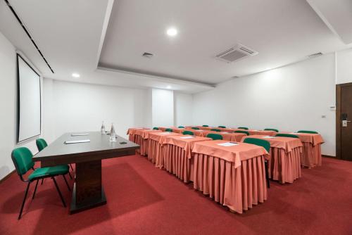a conference room with tables and chairs in it at Exe São Lázaro in Bragança