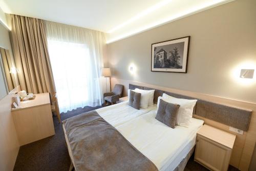 Nota Bene Hotel & Restaurantにあるベッド
