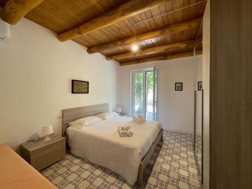 Ένα ή περισσότερα κρεβάτια σε δωμάτιο στο Casale Dionisia, Santa Maria di Castellabate