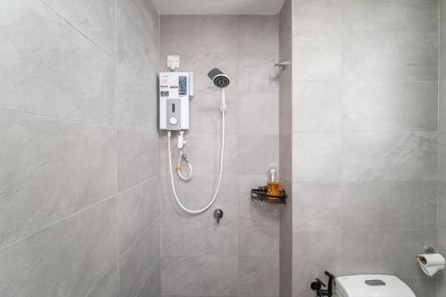 a bathroom with a shower with a toilet in it at Setia Alam Convention Centre 3 Bedroom 2-9Pax #33 in Shah Alam