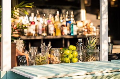 a bar with a table with fruit and drinks at Inselhotel Rügen in Göhren