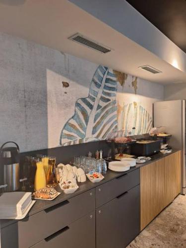 a kitchen with plates of food on a counter at Boutique & Wellness Hotel Vital in Moravske Toplice