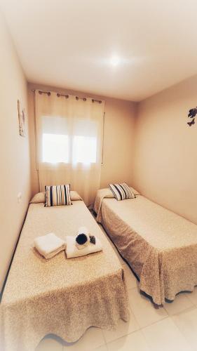 two beds sitting next to each other in a room at L'Essència de l'Empordà -Girona-COSTA BRAVA in Verges