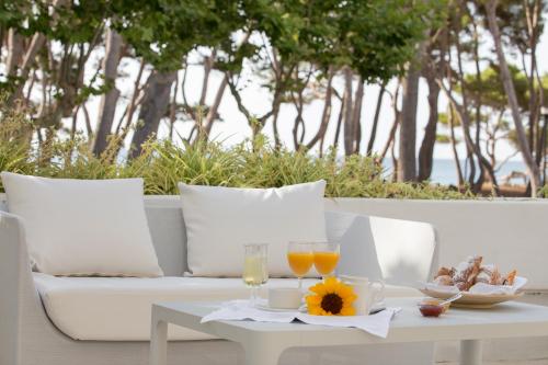a table with two glasses of wine and a tray of food at Canyamel Park Hotel & Spa - 4* Sup - Adults only (+16) in Canyamel