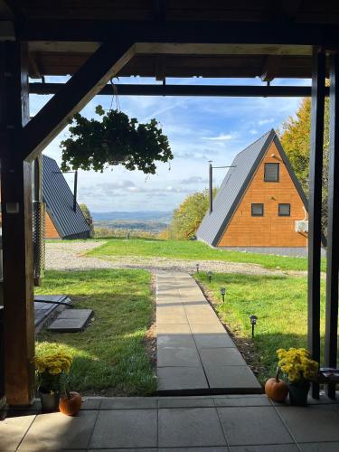 a view of a barn from the porch of a house at Rock Valley Cabins A-frame in Ibăneşti