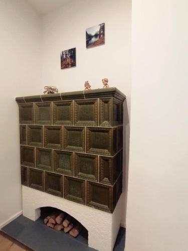 a wall with a fire place in a room at Augl Bischofsgrün in Bischofsgrün