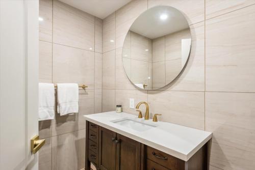 a bathroom with a sink and a mirror at New Listing Renovated 2 BR w AC in Aspen