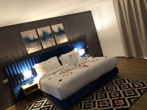 Postel nebo postele na pokoji v ubytování Hôtel Hariz Son