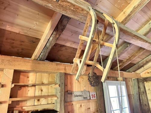 a ceiling in a room with wooden walls at Revier Natur pur in Glarus