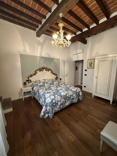 Ένα ή περισσότερα κρεβάτια σε δωμάτιο στο Locanda Guidi