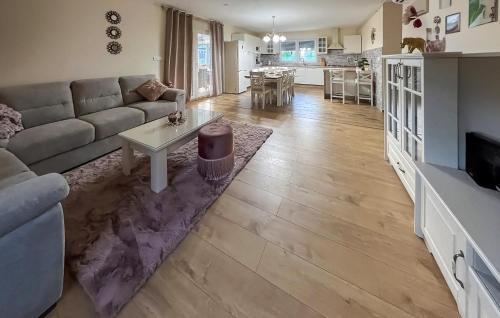 a living room with a couch and a table at Lovely Home In Krapinske Toplice in Krapinske Toplice