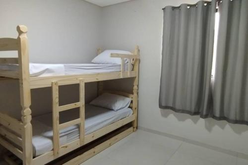 Ένα ή περισσότερα κρεβάτια σε δωμάτιο στο Residencial Paraíba Casa M E