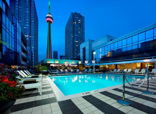 a large swimming pool in a large city at Radisson Blu Downtown Toronto in Toronto