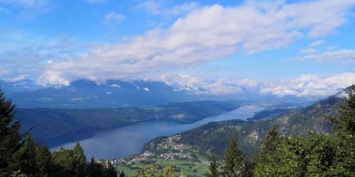 a view of a lake in the mountains at HET Lounge in Radenthein