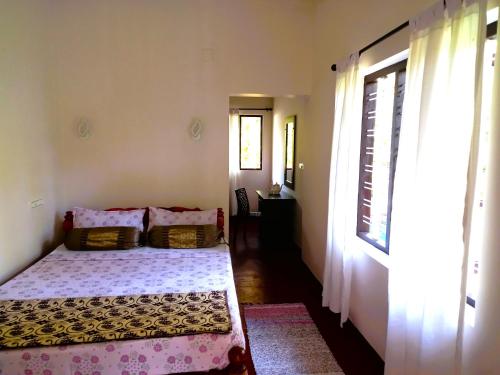 Postel nebo postele na pokoji v ubytování Bella Beach Villa