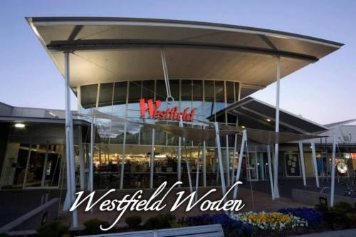 a view of awestfield poker building with a sign on it at Modern Homy 1B1B APT Pool Gym Cinema Westfield Cafe in Phillip