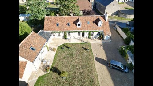 an aerial view of a house with a car parked in front at Domaine de Praline Arthur in Villerbon