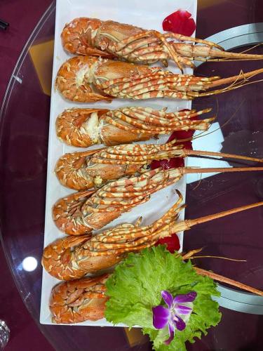 a bunch of corn on a plate on a table at Peace Hotel Hạ Long in Ha Long