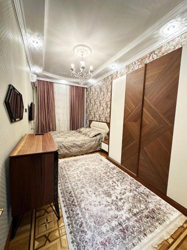 Llit o llits en una habitació de Nizami 4Room