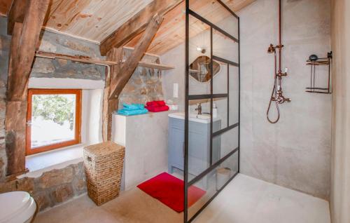 a bathroom in a tiny house with a shower at Lovely Home In Saint Etienne De Serre in Saint-Étienne-de-Serres