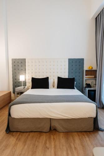 a bedroom with a large bed in a room at Vain Boutique Hotel in Buenos Aires