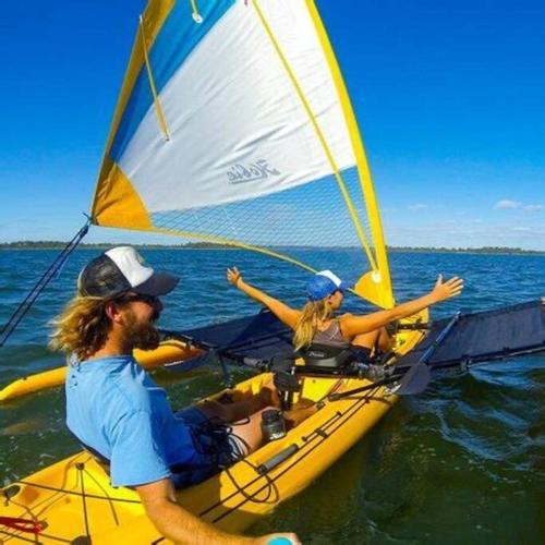 two people on a sail boat in the water at Mandurah Oasis Retreat in Mandurah