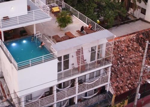an overhead view of a building with a swimming pool at MuchoSur Santa Marta in Santa Marta