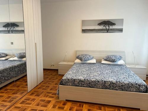 Postel nebo postele na pokoji v ubytování Melide lake apartment