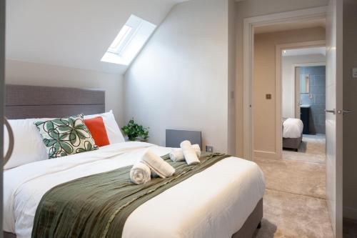 Ένα ή περισσότερα κρεβάτια σε δωμάτιο στο Somers Suites Apartments