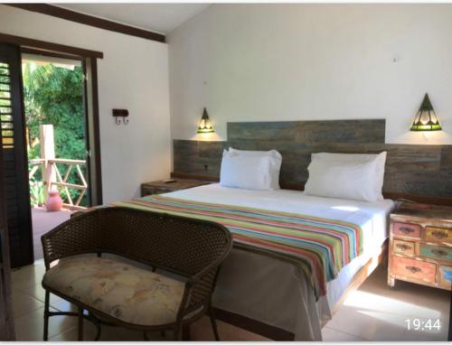 Postel nebo postele na pokoji v ubytování Casa Verde Residence - Piscina , conforto e localização na Praia do Forte