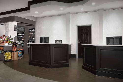 a store with black counters in a room at Hilton Garden Inn Jacksonville Downtown Southbank in Jacksonville