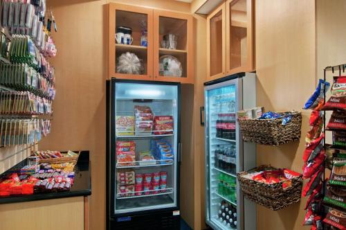 a refrigerator in a store with food in it at Hilton Atlanta Perimeter Suites in Atlanta