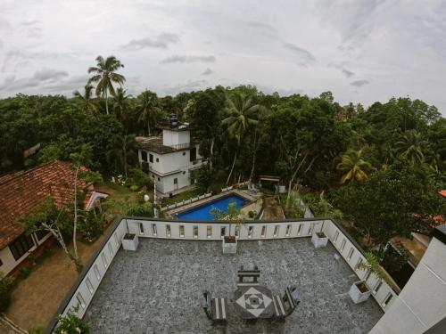 an aerial view of a house and a swimming pool at Wijaya Villa in Habaraduwa