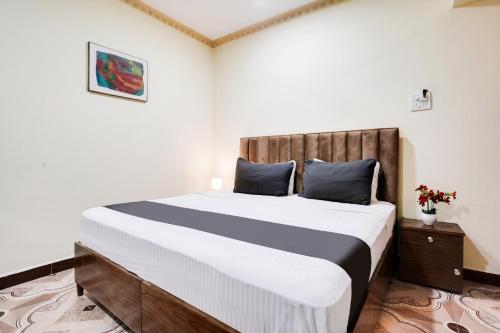 Postel nebo postele na pokoji v ubytování Super Collection O Calangute