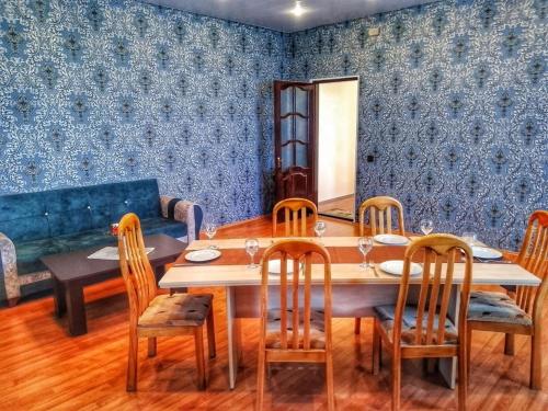 a dining room with a table and chairs at Garden F Sheki in Sheki