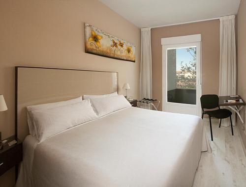 Ліжко або ліжка в номері El Hostal de Violeta