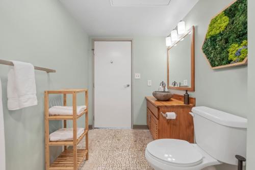 a bathroom with a toilet and a sink at 312-Downtown Haven Hideaway SofaBed Parking Wi-Fi Cafe in Cleveland