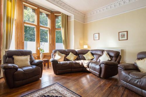 a living room with leather furniture and a couch at Host & Stay - Chatsworth Townhouse II in Carlisle