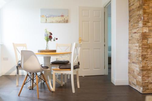 a dining room with a table and chairs at Burren Court Lodge in Ballyvaughan