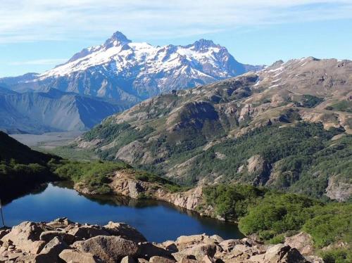 a view of a mountain range with a lake in the foreground at Cabañas el Mirador in Recinto