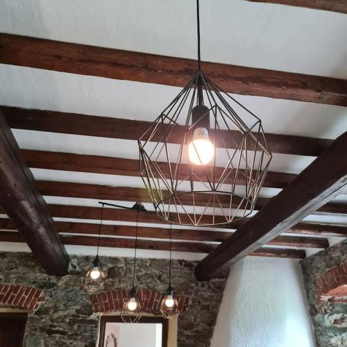a chandelier hanging from the ceiling in a room at Fun it House in Mezzenile